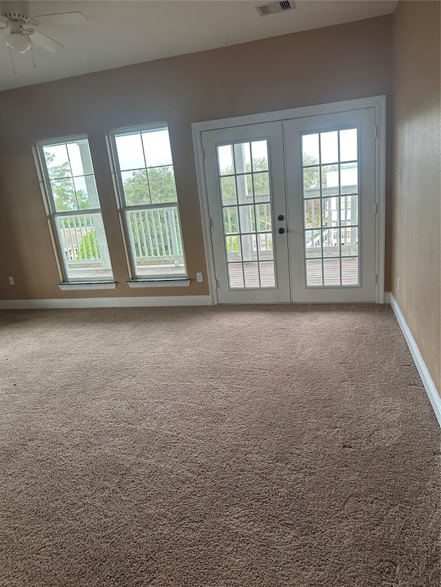 carpeted empty room with ceiling fan