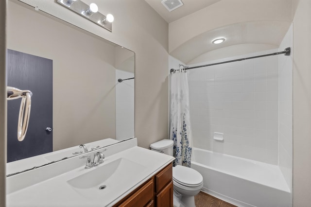 full bathroom with vanity, shower / bath combo, wood-type flooring, and toilet