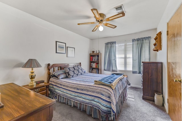 bedroom featuring ceiling fan and dark colored carpet