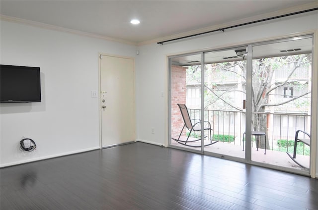 unfurnished living room with dark hardwood / wood-style floors, crown molding, and a wealth of natural light