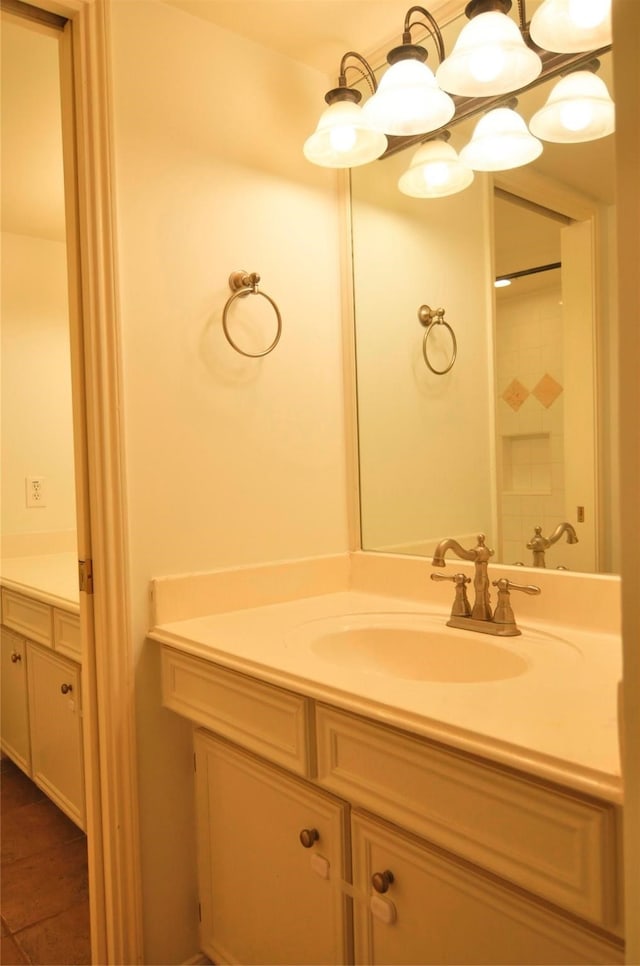 bathroom featuring a shower and vanity