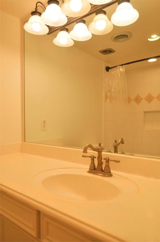 bathroom featuring vanity and a shower with shower curtain