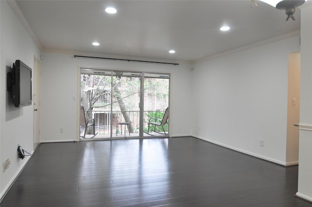 empty room featuring dark wood-type flooring and crown molding