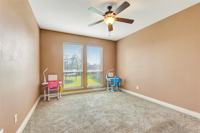 unfurnished room with carpet and ceiling fan