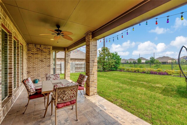 view of patio / terrace featuring ceiling fan