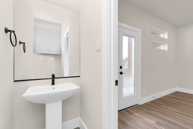 bathroom with sink and hardwood / wood-style flooring