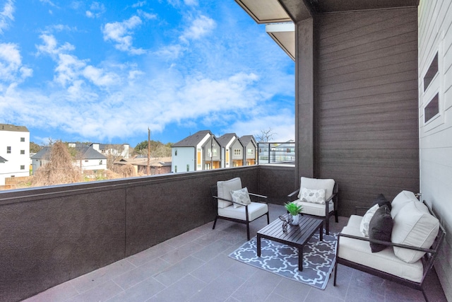 view of patio / terrace featuring a balcony and an outdoor living space