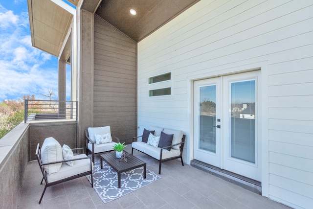 balcony with french doors and outdoor lounge area