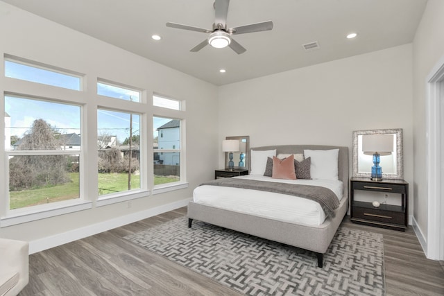 bedroom with ceiling fan and hardwood / wood-style floors