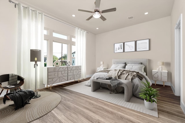 bedroom featuring wood-type flooring and ceiling fan