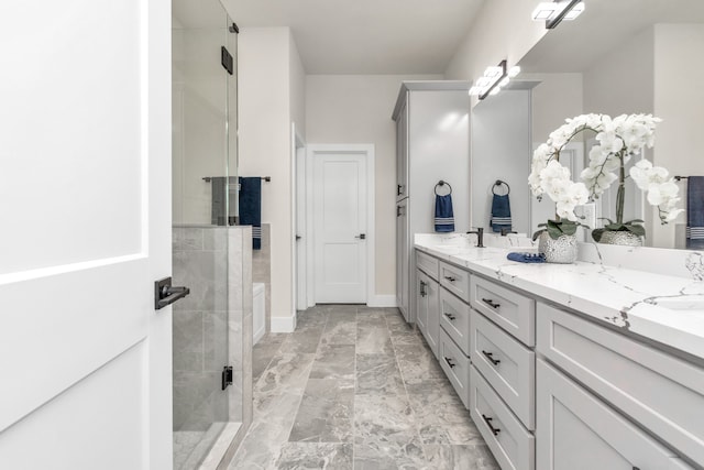 bathroom with vanity and an enclosed shower