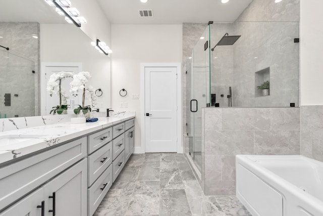 bathroom with shower with separate bathtub and vanity