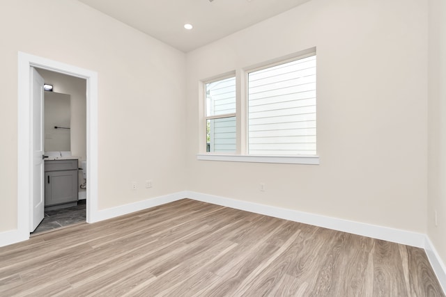 unfurnished bedroom featuring light wood-type flooring