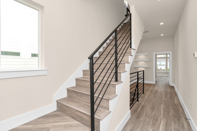 staircase featuring hardwood / wood-style floors