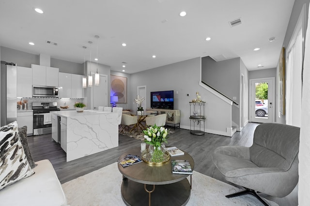 living room featuring dark hardwood / wood-style floors