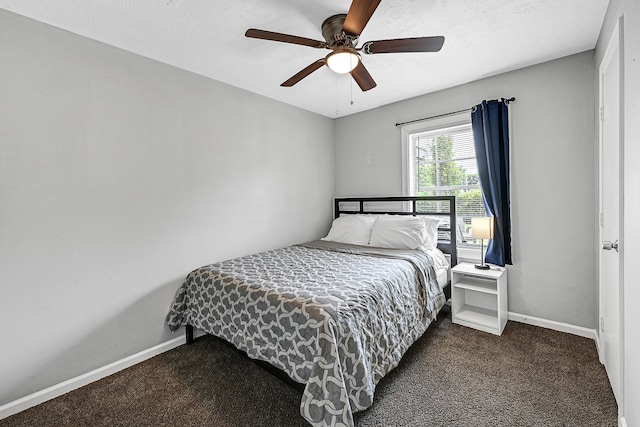 bedroom with dark carpet and ceiling fan