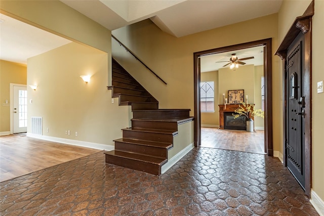 foyer with ceiling fan and hardwood / wood-style flooring