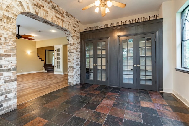 entryway featuring french doors, dark hardwood / wood-style flooring, and ceiling fan