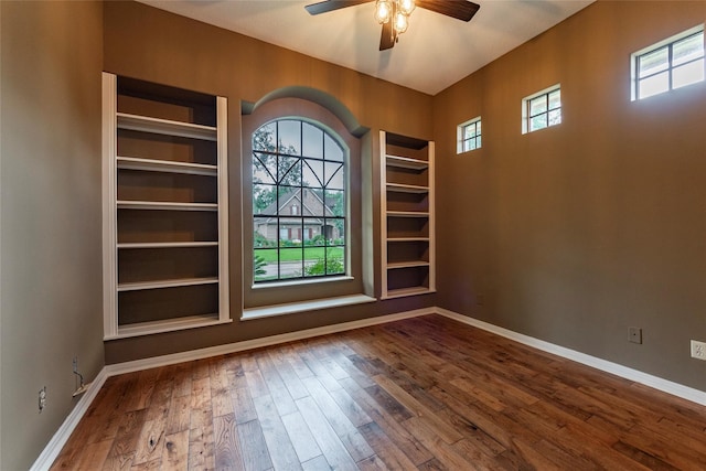 empty room featuring hardwood / wood-style floors and ceiling fan