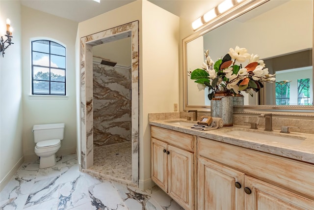 bathroom with vanity, a shower, and toilet