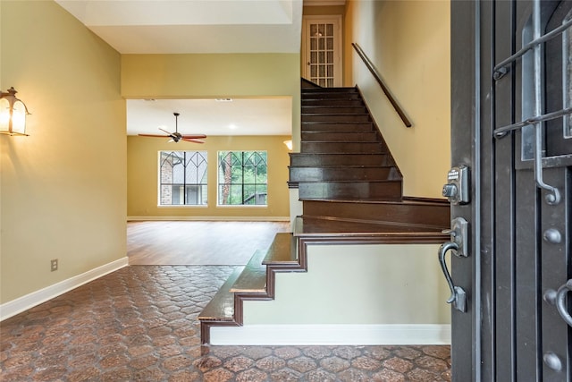 stairway with ceiling fan