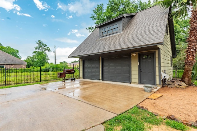 garage featuring a lawn