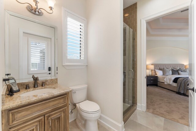 bathroom with vanity, toilet, tile patterned floors, and a shower with shower door