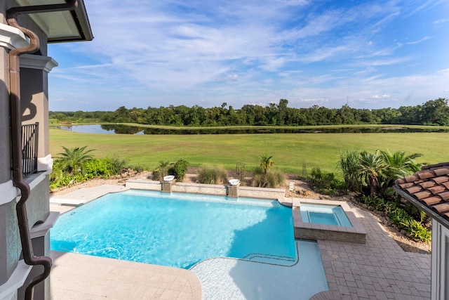 view of pool with a water view, a patio, an in ground hot tub, and a yard