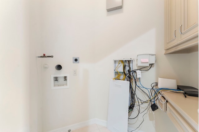 laundry area with washer hookup, cabinet space, electric dryer hookup, and baseboards