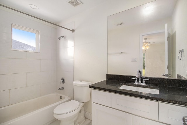 full bathroom featuring toilet, visible vents, tub / shower combination, and vanity