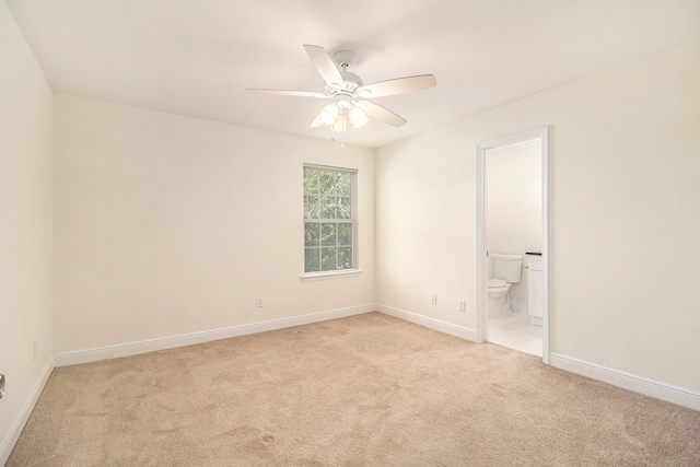 spare room with light carpet and ceiling fan