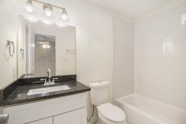 bathroom featuring vanity, a ceiling fan, and toilet