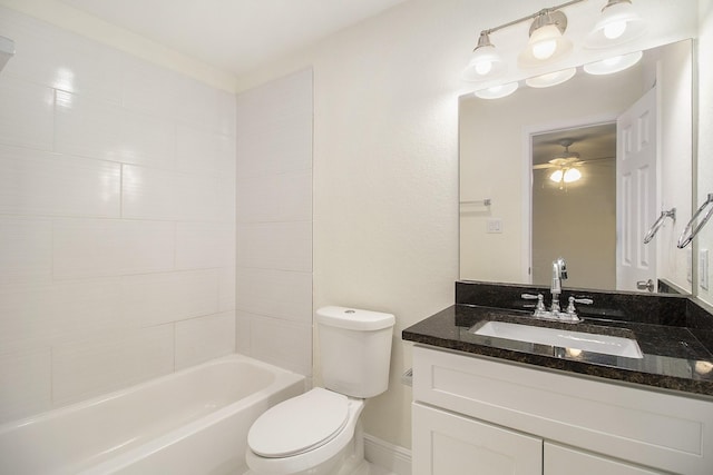 bathroom with vanity, a ceiling fan, shower / tub combination, and toilet