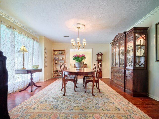 dining area featuring a chandelier, crown molding, dark hardwood / wood-style flooring, and a healthy amount of sunlight