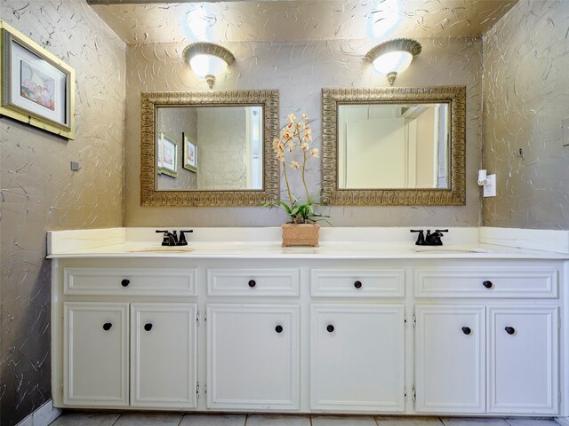 bathroom with tile patterned floors and vanity