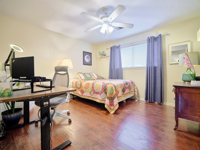 bedroom featuring hardwood / wood-style floors and ceiling fan