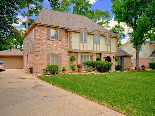 view of front facade with a garage and a front yard