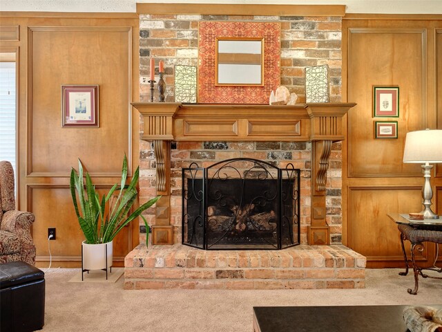 carpeted living room with wooden walls and a brick fireplace