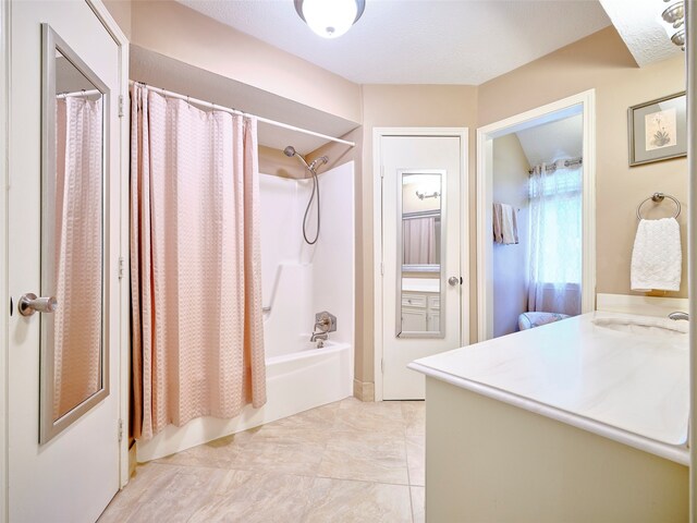 bathroom featuring vanity and shower / bath combo with shower curtain