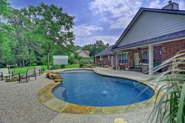 view of swimming pool featuring a patio