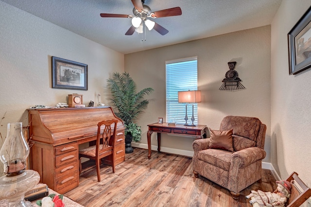 office with ceiling fan, a textured ceiling, and light hardwood / wood-style floors