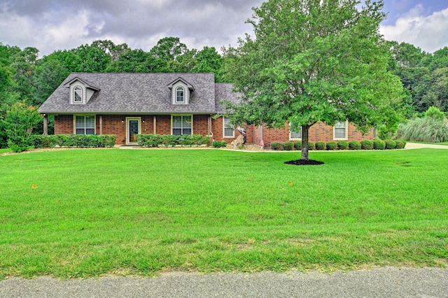 new england style home with a front lawn