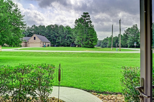 view of yard with a garage