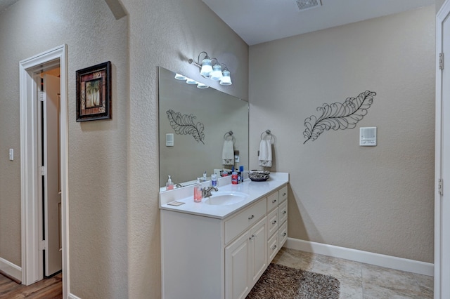 bathroom with vanity and tile patterned floors