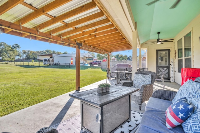 view of patio featuring outdoor lounge area, a ceiling fan, and fence