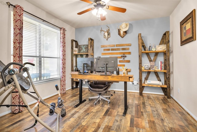 home office featuring ceiling fan, baseboards, and wood finished floors