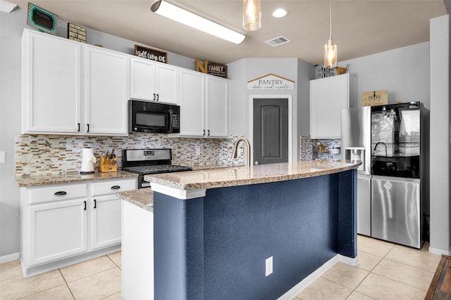 kitchen featuring light tile patterned floors, visible vents, appliances with stainless steel finishes, and white cabinets