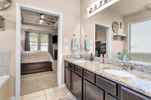 full bathroom featuring a sink, double vanity, tile patterned flooring, and connected bathroom