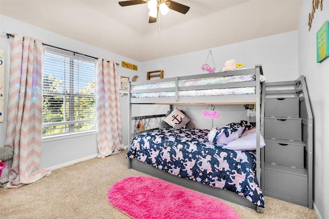 bedroom with a ceiling fan, baseboards, and carpet floors