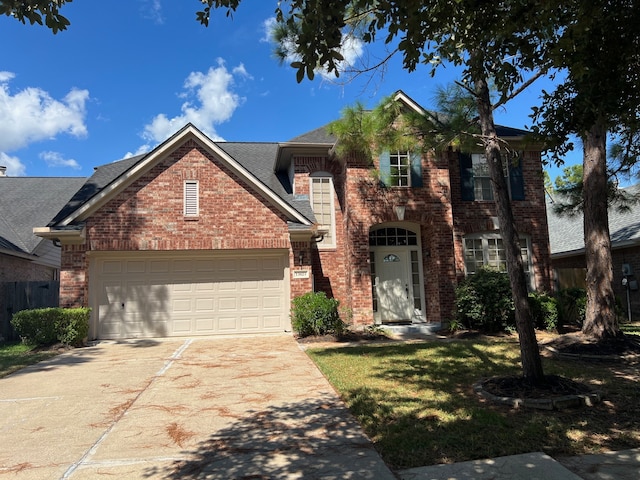 front of property with a garage and a front lawn